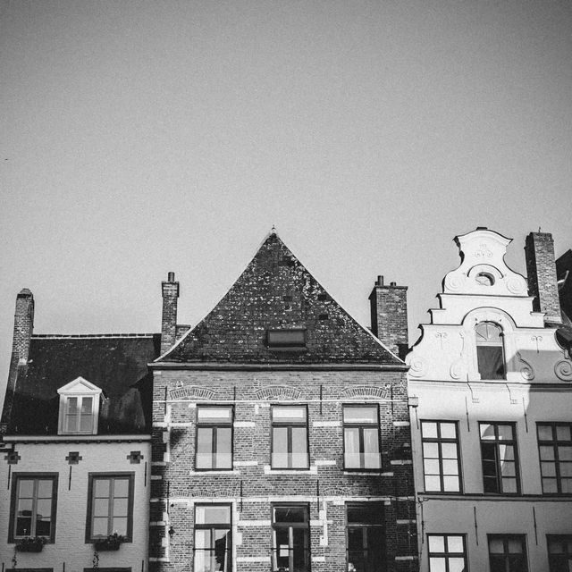 Evening lights, old bricks, and soft skies. · Leuven, Belgium
