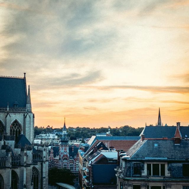 Evening lights, old bricks, and soft skies. · Leuven, Belgium
